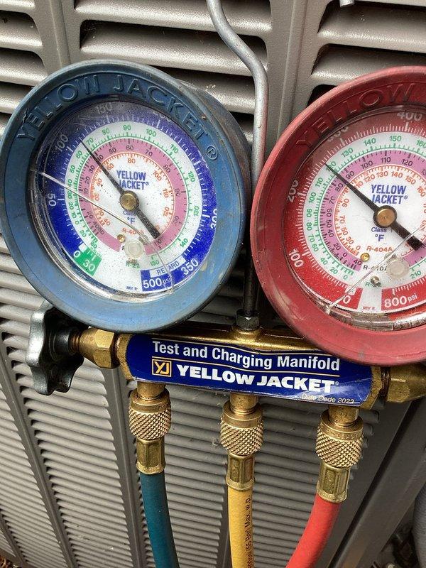 Responded to no cooling complaint on residential air conditioning system. Connected manifold gauges to condenser unit to diagnose system pressures and determine cause of cooling failure. System evaluation completed to identify necessary repairs.