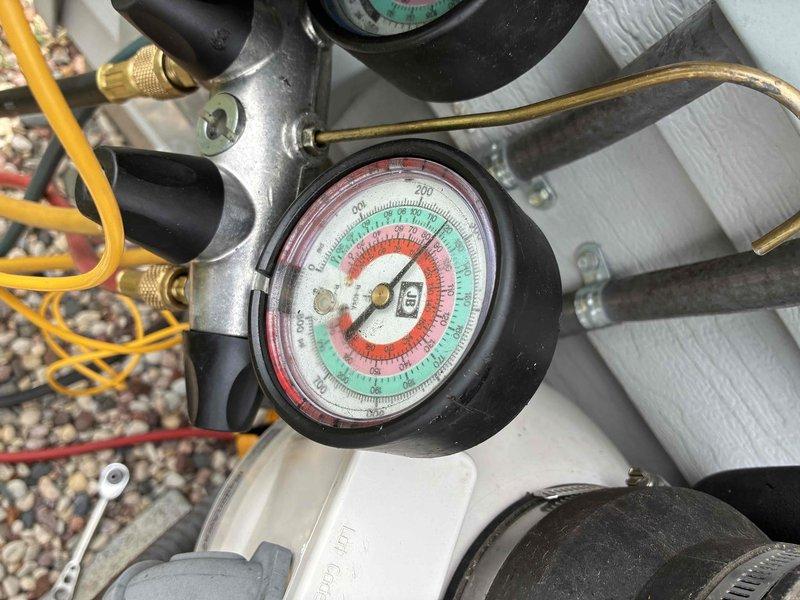 Completed comprehensive AC tune-up service on outdoor condensing unit. Connected manifold gauge set to measure refrigerant pressures and verify system performance within manufacturer specifications. All system parameters checked normal and unit operating efficiently.