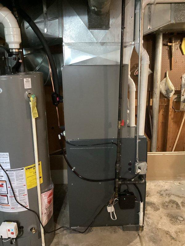 Completed installation of new Goodman HVAC system including air conditioning unit and evaporator coil in residential basement mechanical room. System was successfully installed, connected to existing ductwork, and all electrical and refrigerant lines were properly terminated. Equipment was tested and confirmed operational upon completion.
