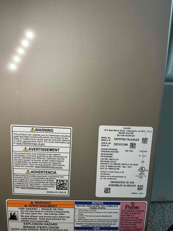 Responded to service call for AC unit leaking issue. Upon arrival, performed system inspection and diagnostics on Carrier CNPVP3617ALA4AA unit containing R-410A refrigerant. Documented unit specifications and current condition with photos for service records.