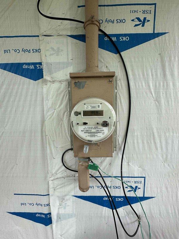 Conducted on-site evaluation for mini split installation in residence without existing ductwork or basement. Assessed electrical service at meter location and main panel to verify capacity for new mini split system. Documented existing electrical infrastructure including meter mounting, service entrance conduit, and available breaker spaces in main distribution panel to determine feasibility of installation and power requirements for proposed ductless heat pump system.