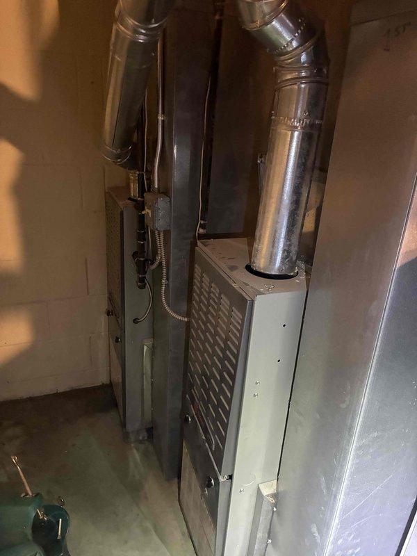 Provided estimate for replacement of furnace and air conditioning system serving the upstairs zone of a two-system residential property after the existing upstairs AC unit failed. Inspected current HVAC equipment installation in basement mechanical room, including existing furnace, air handler, and associated ductwork and gas line connections, and documented equipment condition with photographs to support replacement recommendations.