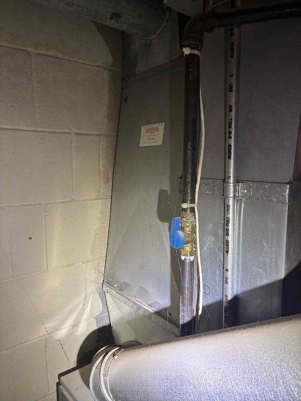 Provided estimate for replacement of furnace and air conditioning system serving the upstairs zone of a two-system residential property after the existing upstairs AC unit failed. Inspected current HVAC equipment installation in basement mechanical room, including existing furnace, air handler, and associated ductwork and gas line connections, and documented equipment condition with photographs to support replacement recommendations.