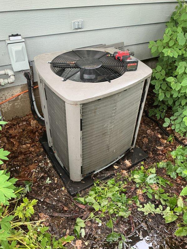 Completed scheduled cooling season maintenance visit on residential air conditioning system. Performed comprehensive tune-up including inspection of outdoor condensing unit, verification of proper operation, and system diagnostics. Unit found in good working condition with appropriate airflow through condenser coils and fan assembly operating normally.