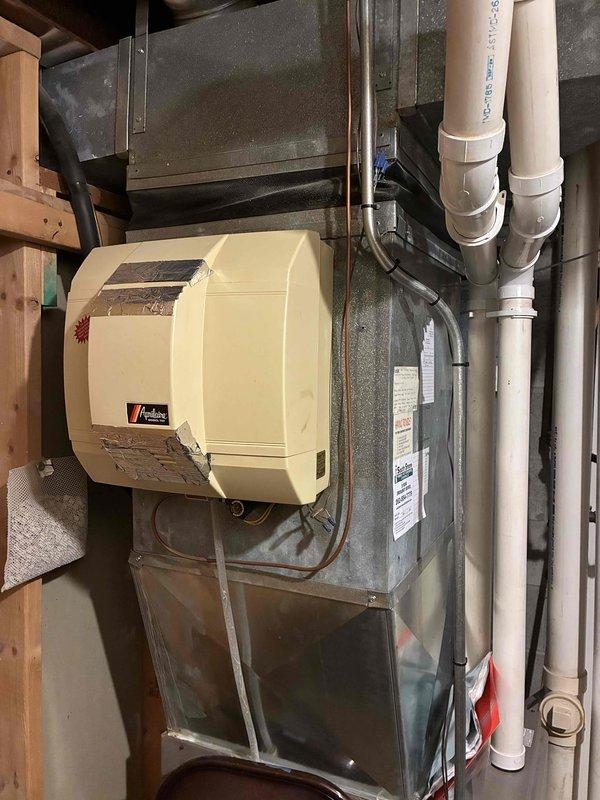 Completed AC replacement estimate for residential HVAC system. Existing furnace confirmed operational with humidifier and proper condensate drainage in place. Air conditioning unit determined non-functional and requires replacement while existing gas furnace remains serviceable.