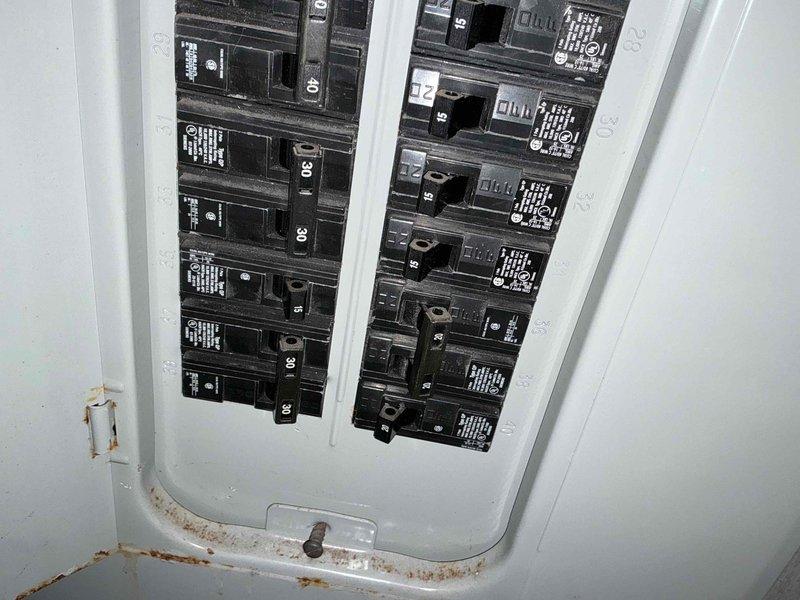 Responded to emergency service call for AC system evaluation. Conducted comprehensive assessment of existing Carrier outdoor condensing unit and associated electrical infrastructure. Documented current equipment condition, electrical panel configuration with visible moisture damage and rust staining at lower enclosure, and exterior disconnect box installation. Provided detailed replacement estimate for complete HVAC system upgrade, including photographic documentation of existing equipment and electrical components for customer review and project planning purposes.