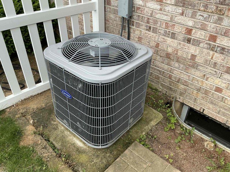 Responded to emergency service call for AC system evaluation. Conducted comprehensive assessment of existing Carrier outdoor condensing unit and associated electrical infrastructure. Documented current equipment condition, electrical panel configuration with visible moisture damage and rust staining at lower enclosure, and exterior disconnect box installation. Provided detailed replacement estimate for complete HVAC system upgrade, including photographic documentation of existing equipment and electrical components for customer review and project planning purposes.