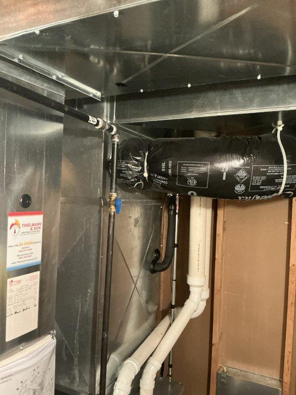 Responded to urgent service call for non-operational air conditioning system and conducted comprehensive assessment of existing HVAC equipment. Evaluated current furnace installation, ductwork configuration, PVC venting system, and condensate drainage lines in basement utility area. Documented equipment specifications, system layout, and installation conditions through detailed photographic documentation. Provided complete replacement estimate for new HVAC system to address failed unit and restore climate control functionality.