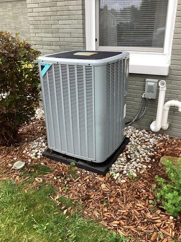 Responded to no cooling complaint on residential air conditioning system. Upon arrival, performed diagnostic evaluation of outdoor condensing unit and associated components. Unit location and installation appear standard with proper clearances maintained. Documented equipment condition and positioning for service records. System requires further troubleshooting to identify root cause of cooling failure and determine necessary repairs for restoration of normal operation.