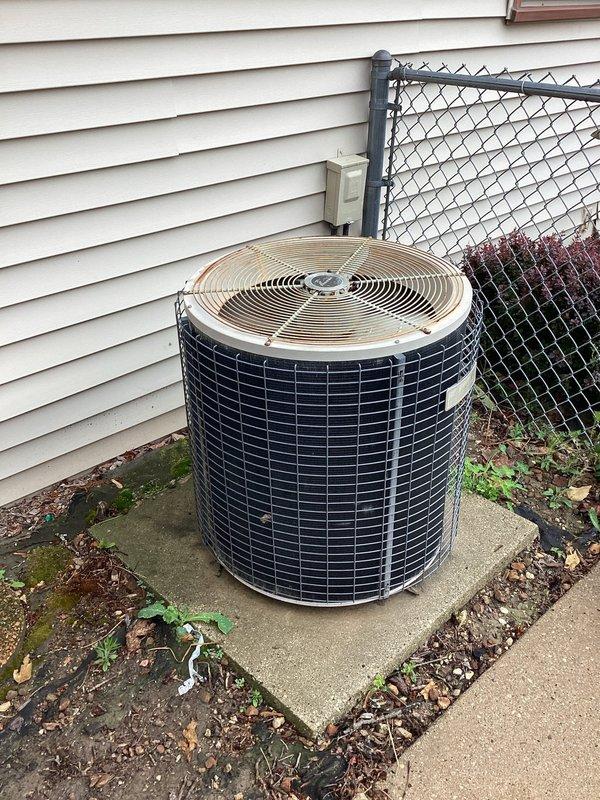 Responded to no cooling complaint on residential air conditioning system. Upon arrival, performed diagnostic inspection of outdoor condensing unit. Unit appeared to be in normal physical condition with protective grilles intact and properly positioned on concrete pad. Completed system evaluation and restored cooling operation. Customer notified of service completion.