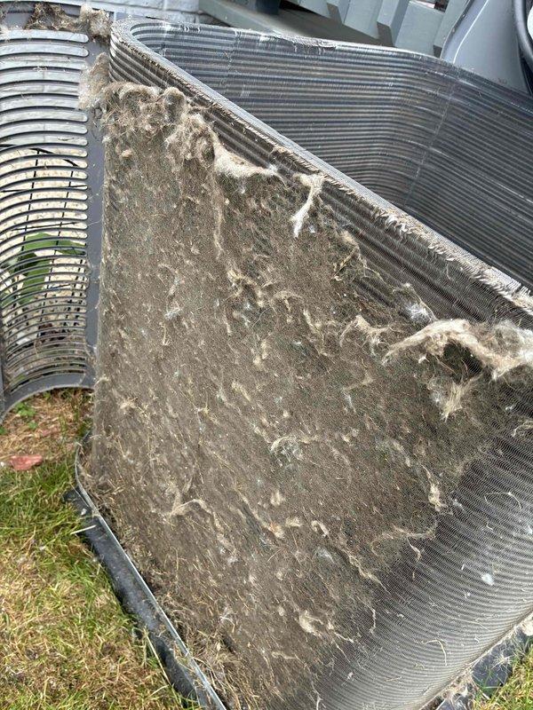 Completed annual air conditioning tune-up on Lennox HVAC system. Performed comprehensive inspection of indoor furnace unit and outdoor condenser, documenting heavy debris accumulation on condenser coil fins requiring cleaning to restore proper airflow and system efficiency. Rescheduled follow-up appointment to complete remaining maintenance tasks.