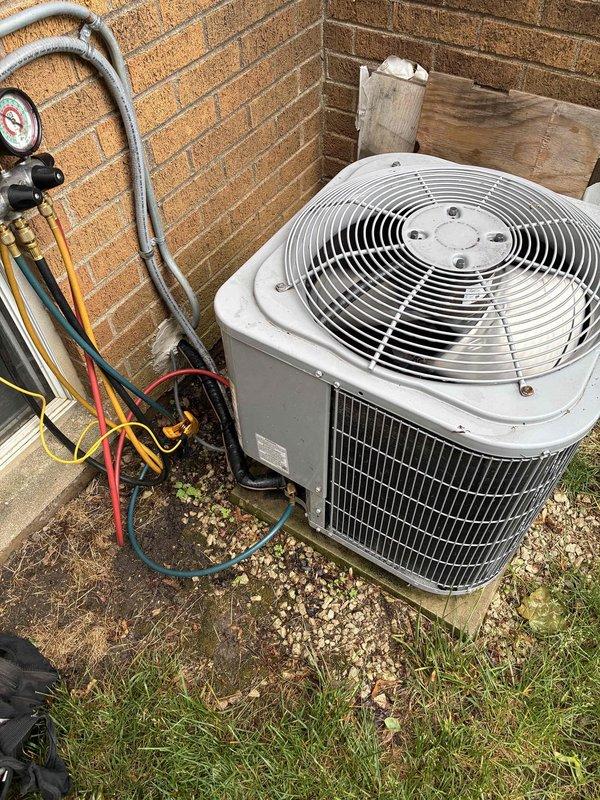 Completed comprehensive AC tune-up on residential condensing unit, including refrigerant pressure verification using manifold gauges and static pressure measurement with digital manometer reading 139. All system parameters checked and confirmed within normal operating range, unit left in proper working condition.