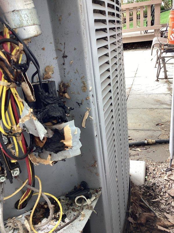 Responded to no cooling complaint on residential HVAC system over 10 years old. Upon arrival, discovered severe electrical failure at outdoor condenser unit with extensive heat damage, burned wiring, and melted insulation throughout the electrical compartment. The condenser's electrical components had catastrophically failed, rendering the unit inoperable and creating a potential safety hazard. Due to the age of the equipment and extent of electrical damage, recommended full system replacement rather than repair. Customer approved replacement of complete HVAC system including outdoor condenser unit and indoor furnace assembly to restore cooling capability and ensure safe, reliable operation.