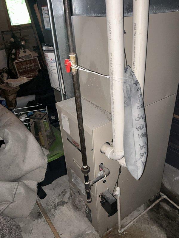 Responded to emergency AC service call and conducted comprehensive system evaluation for replacement estimate. Assessed existing Lennox outdoor condensing unit and indoor air handler/furnace system, documented current equipment condition showing age-related wear and outdoor exposure, photographed installation configuration including ductwork connections, PVC drainage lines, copper refrigerant piping with shutoff valve, and electrical conduit routing for replacement planning purposes.