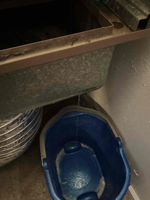 Responded to no cooling complaint on residential air conditioning system. Upon arrival, performed diagnostic evaluation of HVAC unit and identified issues affecting cooling performance. Inspected condensate drainage system, noting water accumulation in drain pan requiring attention. Evaluated air filtration system and observed multiple filters staged for replacement. Addressed cooling deficiency through systematic troubleshooting of mechanical components and airflow restrictions. Restored proper system operation and verified adequate cooling output upon completion.
