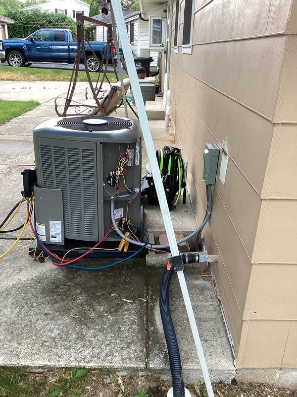 Completed full HVAC system upgrade, replacing existing equipment with a new high-efficiency 90% AFUE furnace and matching air conditioning condenser unit. Installed furnace in basement utility area with proper PVC venting for intake and exhaust, established condensate drainage, and mounted electrical controls and wiring on dedicated board. Positioned outdoor condenser unit on concrete pad with refrigerant line set running to interior equipment, installed disconnect box on exterior wall, and completed all electrical connections per manufacturer specifications and local code requirements.