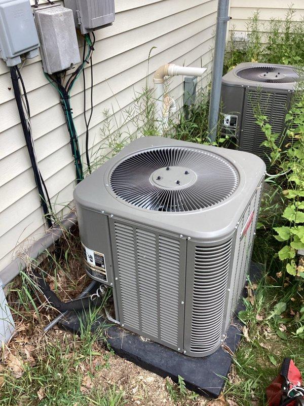 Responded to no cooling complaint on aging HVAC system. Upon arrival, performed diagnostic inspection of both indoor furnace unit and outdoor condensing units. Accessed furnace cabinet to inspect internal components, electrical connections, and control systems. Evaluated outdoor equipment condition, noting two condensing units present at property with vegetation growth around units affecting airflow. Completed system assessment and documented equipment condition with photos for service records.