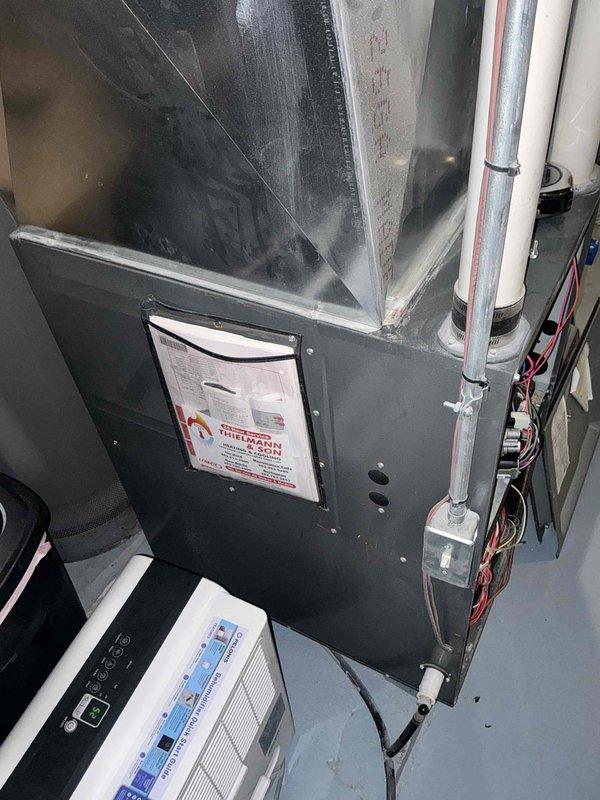 Responded to no cooling emergency call and performed comprehensive system assessment. Documented existing HVAC equipment configuration including furnace unit, ductwork, and condensing unit setup in mechanical room. Evaluated current system condition, noting operational components, electrical connections, and PVC condensate drainage. Provided detailed replacement estimate for complete HVAC system upgrade to restore cooling capability and improve overall system efficiency.