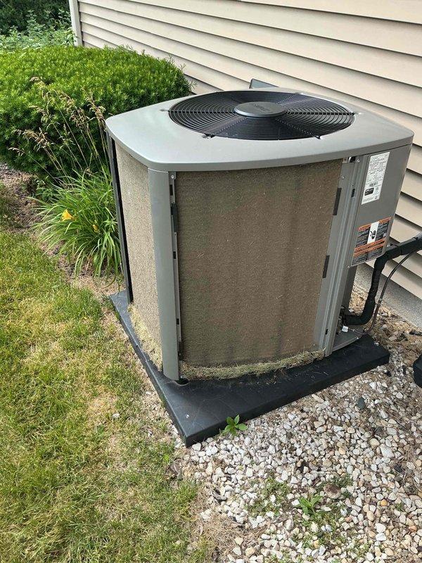 Completed comprehensive AC tune-up on outdoor condensing unit, performing standard maintenance procedures including electrical testing with digital multimeter to verify proper amperage and voltage readings. Unit operating within normal parameters; condenser positioned on proper pad with adequate clearance and gravel base for drainage.