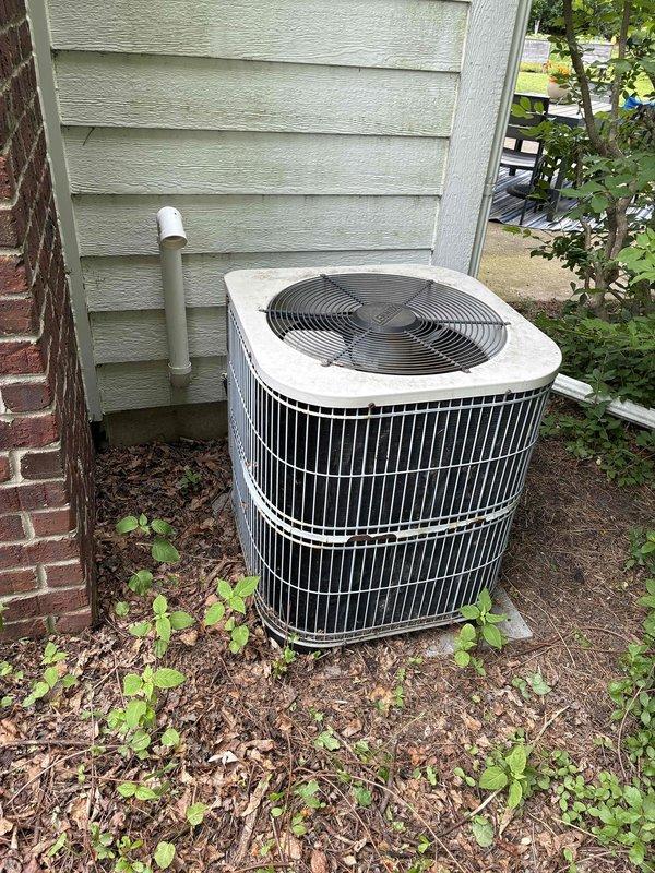 Completed estimate for full HVAC system replacement at residential property. Evaluated existing Zieco furnace located in basement utility room and outdoor AC condenser unit with grid-pattern fan grille; outdoor unit showing signs of neglect with vegetation growth around base and confirmed non-operational status. Provided replacement recommendations for both heating and cooling equipment to restore complete climate control functionality.