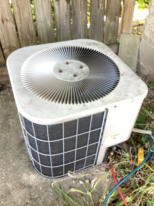 # HVAC No Cool Service Call - 21-Year-Old System

Responded to no cooling complaint on residential air conditioning system approximately 21 years old. Homeowner reported thermostat was set to 70 degrees but indoor temperature continued rising to 77 degrees before system was shut down. Courtesy call made prior to arrival.

Upon arrival, performed comprehensive diagnostic evaluation of aging split system. Outdoor condenser unit showed significant accumulation of dirt, grime, and biological growth on exterior surfaces and protective grilles, indicating extended period without maintenance. Unit positioned on concrete pad showed signs of age-related deterioration. Indoor air handler and associated ductwork inspected in attic space, with PVC condensate lines and refrigerant piping examined for proper operation.

Conducted systematic troubleshooting to identify root cause of cooling failure. Checked electrical components, refrigerant pressures, airflow, and thermostat operation. Based on age 