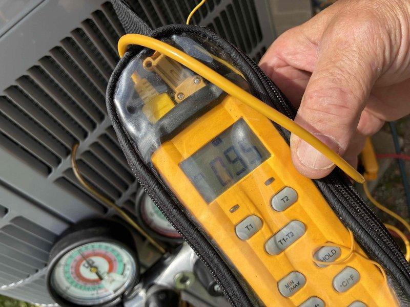 Completed prepaid A/C tune-up maintenance service on residential HVAC system. Performed comprehensive system diagnostics using digital multimeter and manifold gauges to verify refrigerant pressures and electrical readings. Inspected outdoor condenser unit and indoor furnace components, confirmed proper operation of all system functions, and documented equipment condition with photos for service records.
