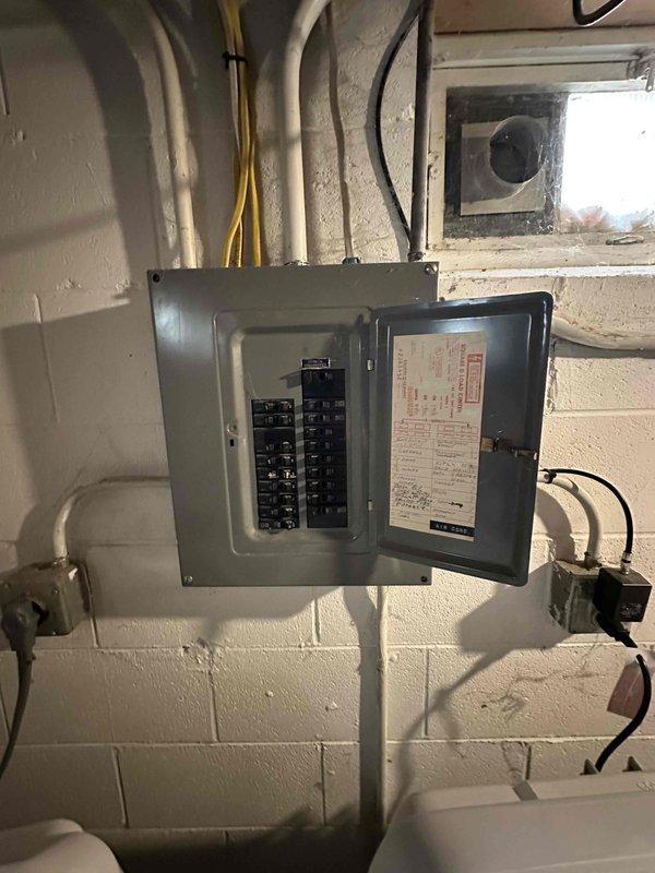 Conducted comprehensive estimate for complete HVAC system replacement including air conditioning unit and furnace located in basement mechanical room. Assessed existing equipment configuration, electrical service panel capacity, venting system, and spatial requirements for new installation while documenting current system layout with detailed photographs for replacement planning purposes.