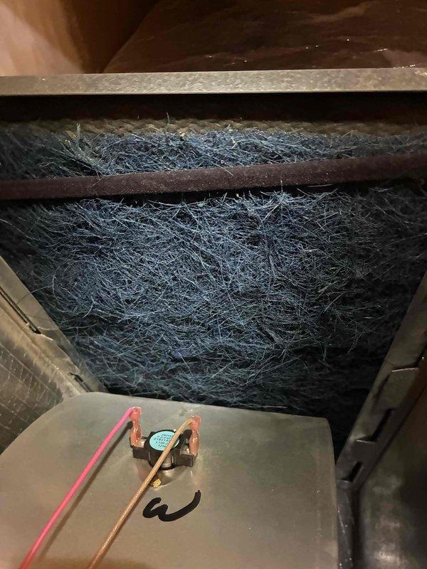 Completed comprehensive tune-up service on Magic Pak combination heating and air conditioning unit. Inspected air filtration system which showed significant dust and debris accumulation on filter media, examined refrigerant lines and connections, and verified thermostat operation with Honeywell programmable unit displaying proper temperature readings and functioning controls. Both heating and cooling systems were evaluated and serviced according to manufacturer specifications.