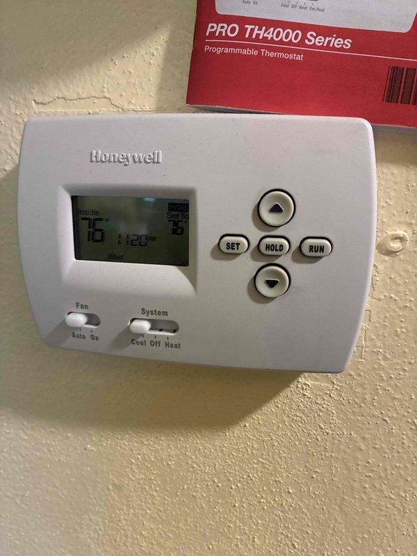 Completed comprehensive tune-up service on Magic Pak combination heating and air conditioning unit. Inspected air filtration system which showed significant dust and debris accumulation on filter media, examined refrigerant lines and connections, and verified thermostat operation with Honeywell programmable unit displaying proper temperature readings and functioning controls. Both heating and cooling systems were evaluated and serviced according to manufacturer specifications.