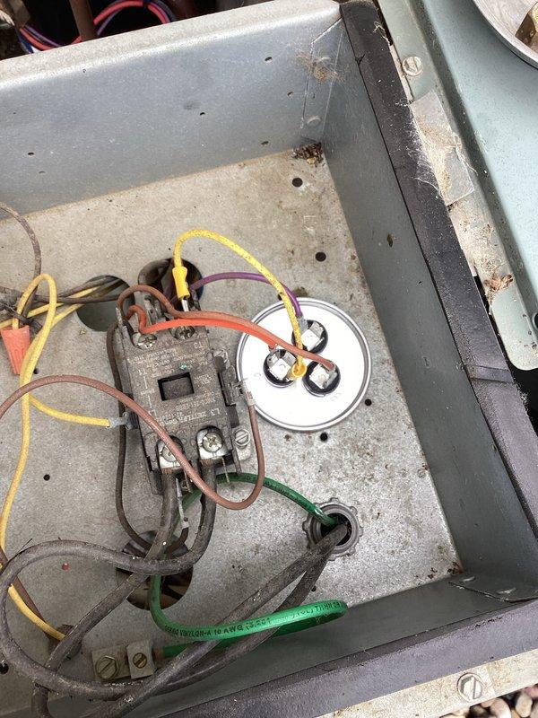Responded to service call for AC unit short cycling - turning on briefly then shutting off after a few minutes before restarting. Upon arrival, performed diagnostic evaluation of outdoor condensing unit. Inspected electrical components in junction box and found contactor showing signs of age and corrosion. Connected manifold gauge set to check refrigerant pressures and system operation. Tested capacitor function and verified all electrical connections. Identified worn contactor as primary cause of intermittent operation and short cycling behavior. System components showed significant weathering consistent with extended outdoor exposure but capacitor tested within normal specifications.