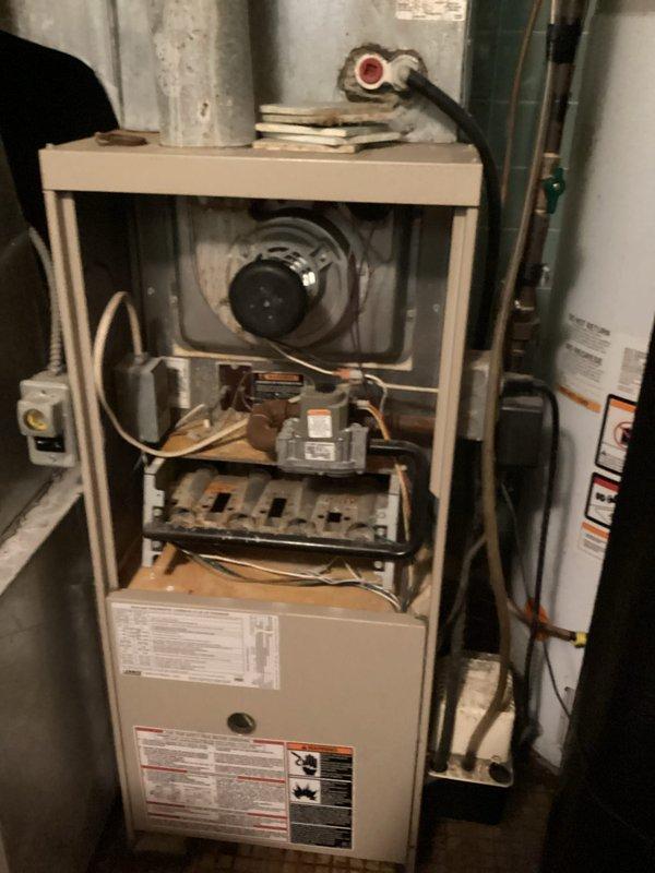 Responded to no cooling call on older residential air conditioning system. Upon arrival, confirmed condenser unit failed to start. Performed diagnostic evaluation to determine root cause of compressor failure. Inspected indoor furnace components and verified proper airflow through system. Documented existing Lennox Pulse Series equipment condition and captured photos of installation for service records. Customer advised of findings and repair options for aging HVAC system.