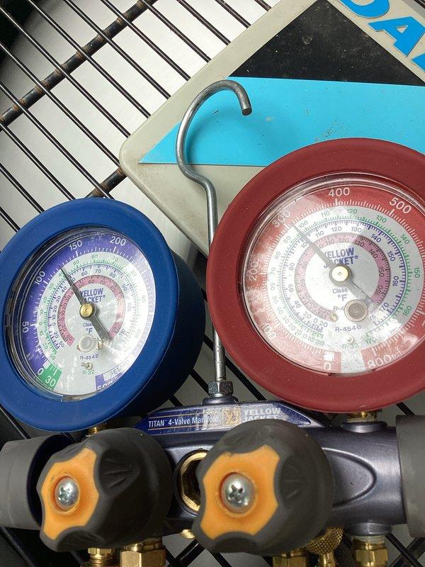 Performed standard air conditioning tune-up and system evaluation. Connected manifold gauge set to measure refrigerant pressures and verify proper system operation. All components inspected and system found to be operating within normal parameters.