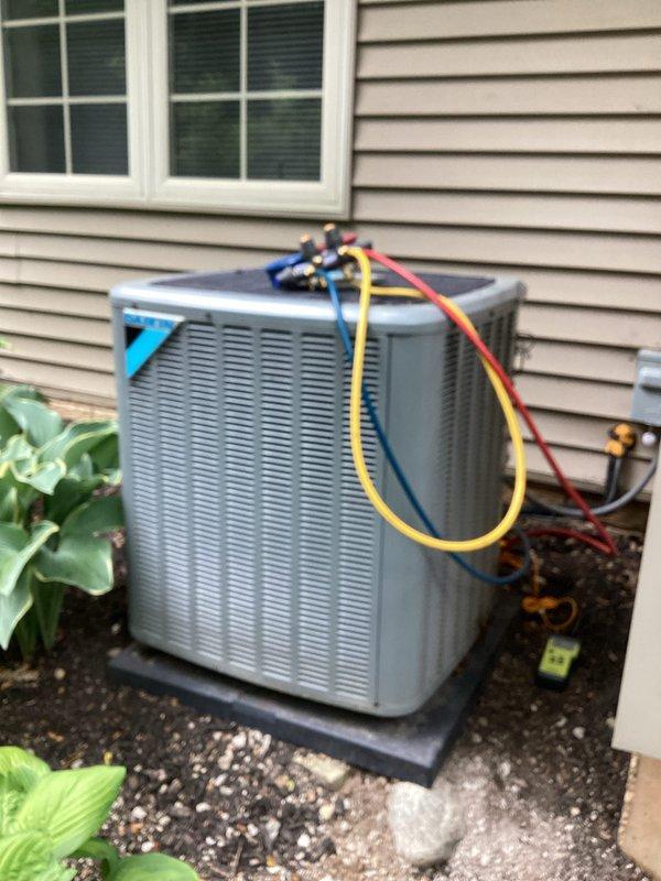 Performed standard air conditioning tune-up and system evaluation. Connected manifold gauge set to measure refrigerant pressures and verify proper system operation. All components inspected and system found to be operating within normal parameters.