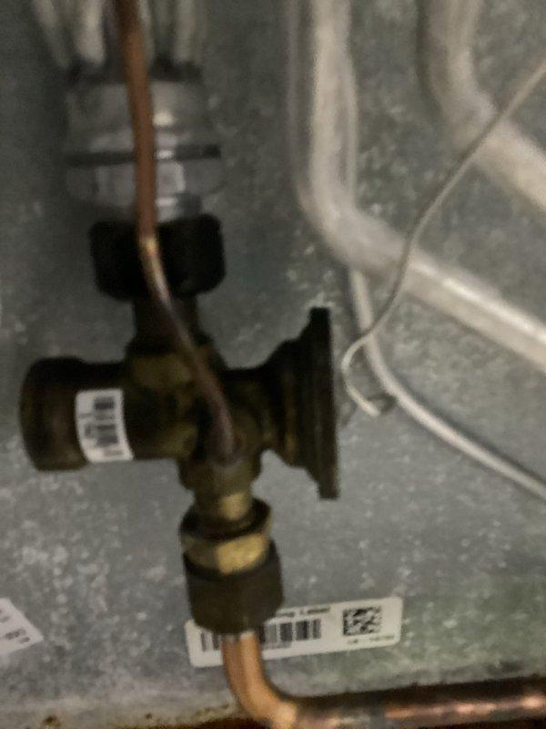 Responded to no heat call and found air handler evaporator coil frozen due to restricted airflow. System was shut down to allow coil to thaw completely. Inspected unit and verified refrigerant lines, drain pan assembly, and internal components. Advised customer on proper filter maintenance to prevent future freeze-ups and restored system to normal operation once coil defrosted.