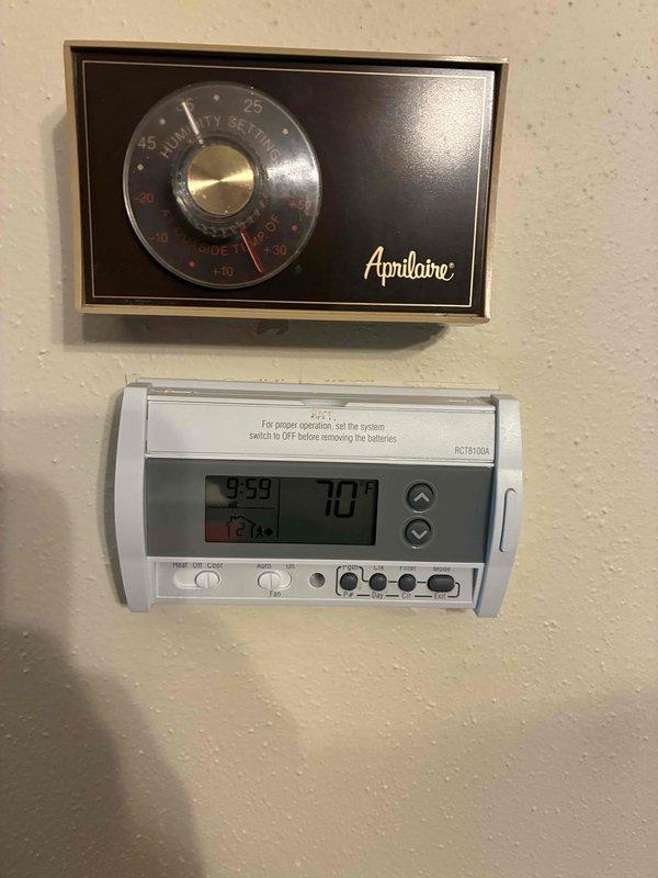 Conducted comprehensive estimate for HVAC system replacement on property with operational but aging 30+ year old furnace and air conditioning unit. Evaluated existing dual thermostat configuration including analog Aprilaire unit and digital programmable model, assessed electrical panel capacity and breaker configuration to determine compatibility requirements for new equipment installation, and documented current system conditions through photographic records to provide accurate replacement specifications and recommendations.