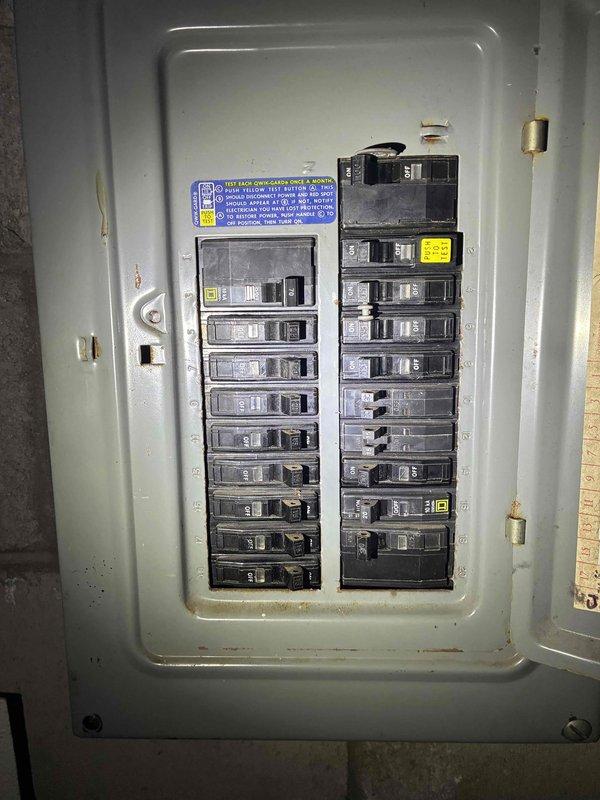 Conducted comprehensive estimate for HVAC system replacement on property with operational but aging 30+ year old furnace and air conditioning unit. Evaluated existing dual thermostat configuration including analog Aprilaire unit and digital programmable model, assessed electrical panel capacity and breaker configuration to determine compatibility requirements for new equipment installation, and documented current system conditions through photographic records to provide accurate replacement specifications and recommendations.