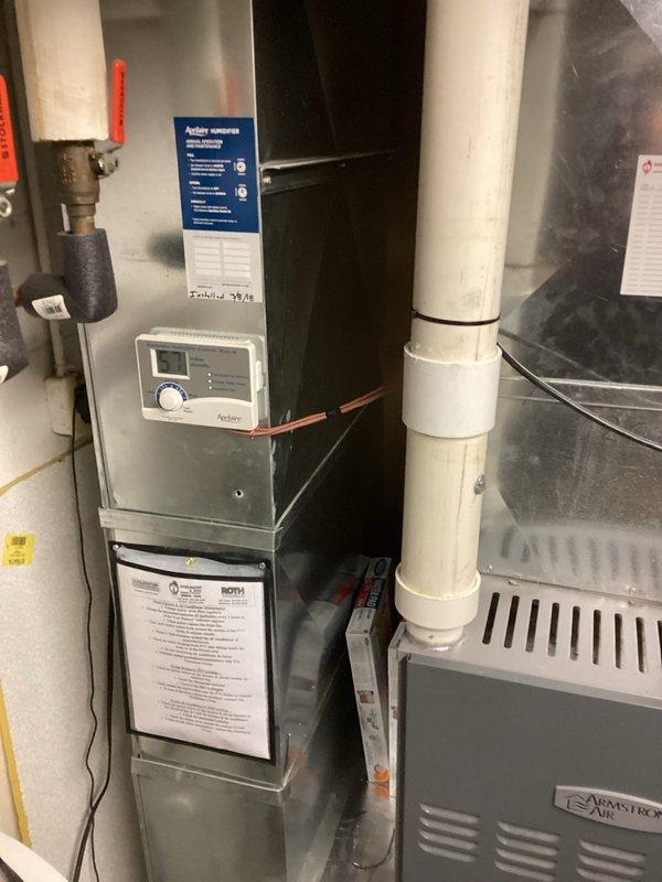 Completed residential air conditioning system installation including new outdoor condensing unit and indoor evaporator coil. Installed Armstrong Air equipment with proper refrigerant line connections and electrical wiring to existing furnace system. Connected and charged system using manifold gauges, verified proper refrigerant levels and system pressures. Mounted outdoor unit on concrete pad with appropriate clearances, routed copper line set and electrical connections through building envelope. Integrated new coil with existing furnace blower system, ensuring proper airflow and drainage. Tested all electrical connections, verified proper voltage supply, and confirmed control panel operation. System commissioned and operational, delivering cooling capacity as designed.