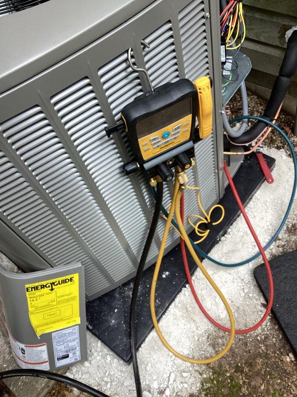 Completed residential air conditioning system installation including new outdoor condensing unit and indoor evaporator coil. Installed Armstrong Air equipment with proper refrigerant line connections and electrical wiring to existing furnace system. Connected and charged system using manifold gauges, verified proper refrigerant levels and system pressures. Mounted outdoor unit on concrete pad with appropriate clearances, routed copper line set and electrical connections through building envelope. Integrated new coil with existing furnace blower system, ensuring proper airflow and drainage. Tested all electrical connections, verified proper voltage supply, and confirmed control panel operation. System commissioned and operational, delivering cooling capacity as designed.
