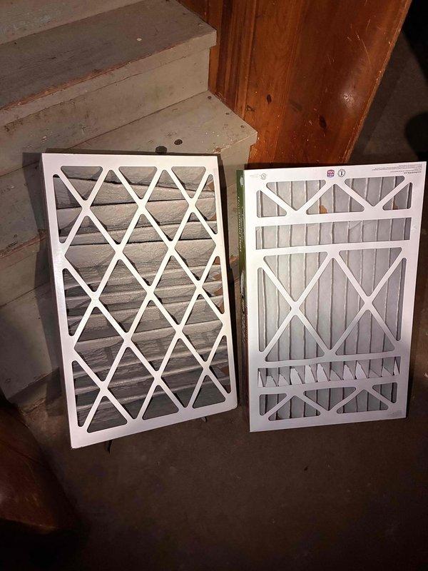Performed comprehensive air conditioning tune-up on Carrier outdoor condenser unit, including system inspection, performance testing, and filter evaluation. Inspected two HVAC air filters showing standard wear patterns and assessed outdoor unit accessibility, noting vegetation growth around condenser that may require clearance to maintain optimal airflow and system efficiency.