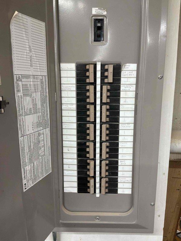 Conducted commercial HVAC equipment assessment for replacement estimate. Documented existing air handler system including aging blower motor assembly with accumulated dust and debris, deteriorated capacitor showing discoloration, and evaluated electrical panel configuration to determine power requirements for new equipment installation.