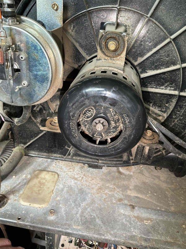 Conducted commercial HVAC equipment assessment for replacement estimate. Documented existing air handler system including aging blower motor assembly with accumulated dust and debris, deteriorated capacitor showing discoloration, and evaluated electrical panel configuration to determine power requirements for new equipment installation.