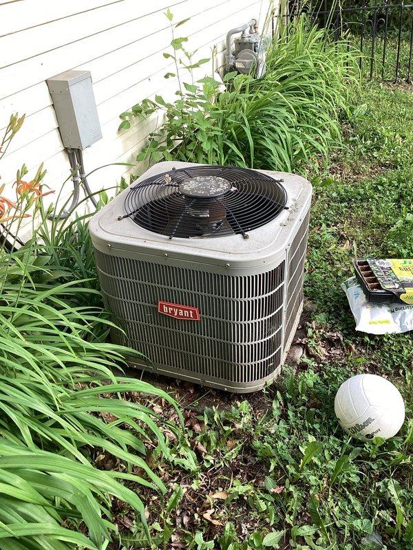 Responded to no cooling complaint on 10+ year old Bryant system. Upon arrival, performed diagnostic evaluation of outdoor condensing unit and attic-mounted air handler. Identified system failure preventing proper cooling operation. Documented equipment condition including outdoor unit surrounded by overgrown vegetation and debris, which can restrict airflow and reduce efficiency. Air handler inspection revealed evidence of water damage on attic flooring beneath unit, indicating previous or ongoing condensate drainage issues. Photographed equipment conditions and discussed findings with homeowner. Recommended vegetation clearance around outdoor unit to maintain proper airflow and prevent future performance issues.