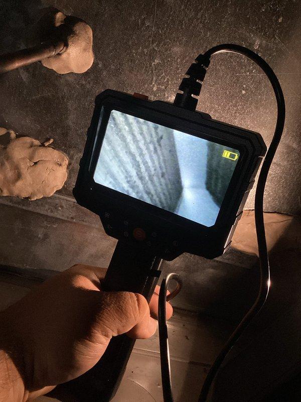 Performed diagnostic service on residential air conditioning system. Connected manifold gauges to outdoor condenser unit to check refrigerant pressures and system performance. Utilized inspection camera to examine interior ductwork and HVAC components for potential issues or obstructions. System evaluation completed with diagnostic equipment to ensure proper operation.