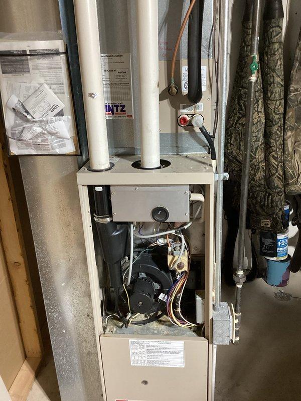 Responded to no cooling complaint on R-22 system. Upon arrival, found evaporator coil completely frozen with ice buildup. Connected manifold gauges to assess system pressures and confirmed restricted airflow as primary cause of freeze condition. Allowed coil to thaw completely, verified blower motor operation, and checked air filter status. System returned to normal operation once ice melted and proper airflow was restored.