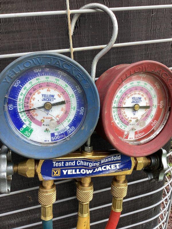 Responded to no cooling complaint on R-22 system. Upon arrival, found evaporator coil completely frozen with ice buildup. Connected manifold gauges to assess system pressures and confirmed restricted airflow as primary cause of freeze condition. Allowed coil to thaw completely, verified blower motor operation, and checked air filter status. System returned to normal operation once ice melted and proper airflow was restored.