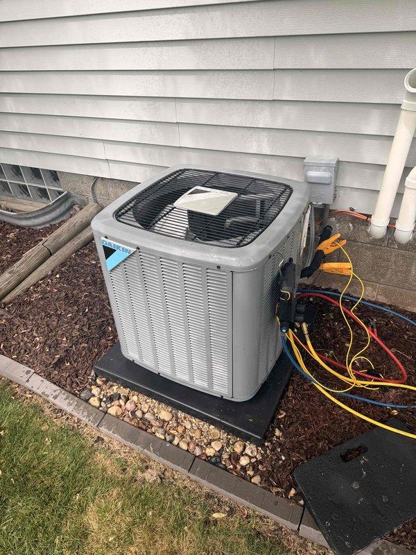 Completed comprehensive air conditioning tune-up and system evaluation on outdoor condenser unit. Connected diagnostic gauges to assess refrigerant pressures and system performance, initiated new maintenance membership for ongoing service coverage. All components functioning properly with no issues identified during inspection.