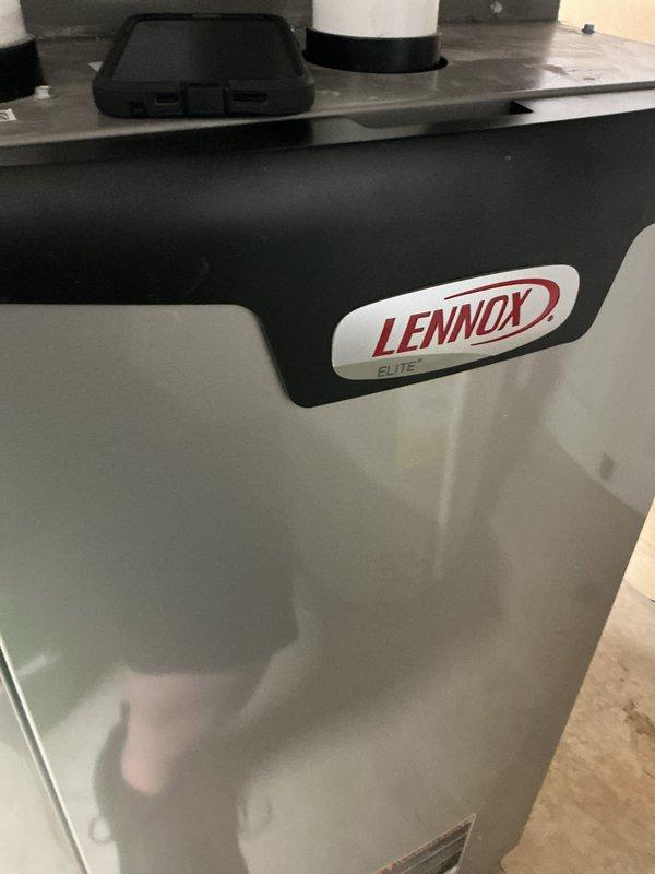 Responded to service call for reported gas odor in furnace exhaust. Performed comprehensive safety inspection of Lennox Elite gas furnace system, including visual examination of heat exchanger, burner assembly, gas valve connections, and venting components. Inspected all gas piping connections, flue pipe seals, and combustion chamber for potential leaks or compromised components. Verified proper operation of blower motor assembly and examined electrical connections to gas valve. All components found to be functioning within normal parameters with no active gas leaks detected at time of inspection.