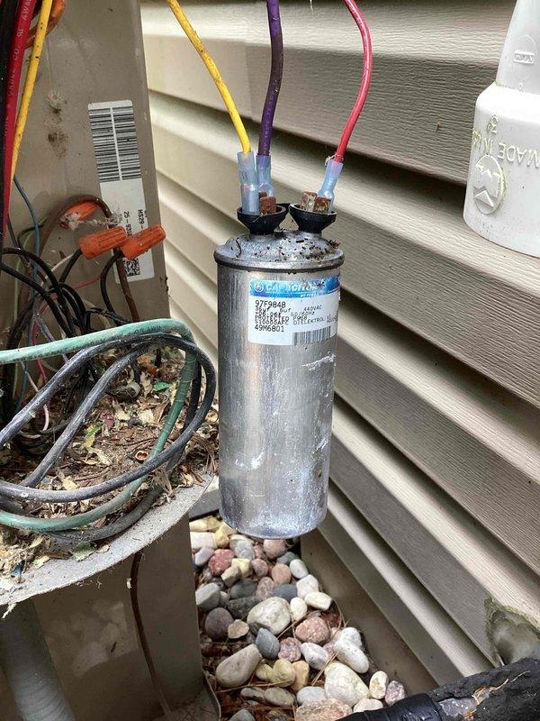 Responded to no cooling call on residential HVAC system. Upon arrival, inspected outdoor unit electrical components and found failed capacitor preventing compressor operation. Replaced defective dual run capacitor with proper rated replacement, verified all electrical connections secure, and tested system operation. Unit restored to normal cooling function with compressor and condenser fan motor running properly.