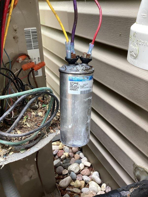 Responded to no cooling call on residential HVAC system. Upon arrival, inspected outdoor unit electrical components and found failed capacitor preventing compressor operation. Replaced defective dual run capacitor with proper rated replacement, verified all electrical connections secure, and tested system operation. Unit restored to normal cooling function with compressor and condenser fan motor running properly.