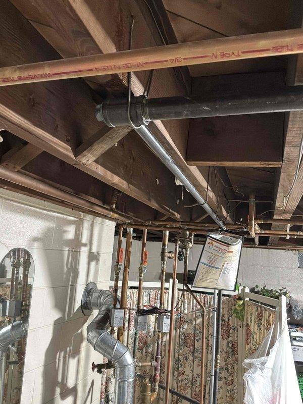 Provided estimate for replacement of existing 50-gallon electric water heater with upgraded 80-gallon electric water heater at rental property. Assessed current A.O. Smith unit installation in basement utility area, evaluated existing plumbing connections including copper supply lines and electrical configuration, and documented conditions for scope of work proposal.